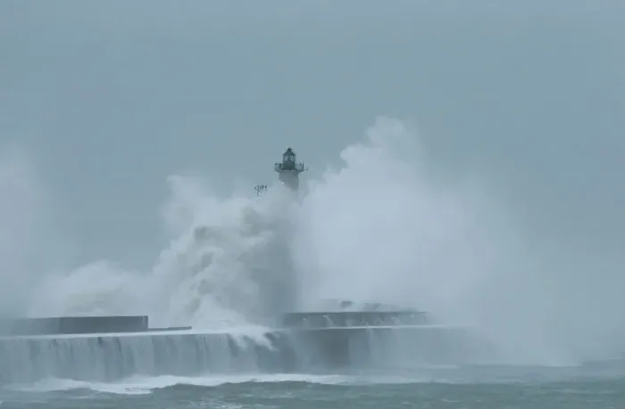 Framed Print : Waves crash against a lighthouse during a windy day in Boulogne-sur-Mer Framed Print : Waves crash against a lighthouse during a windy day in Boulogne-sur-Mer
