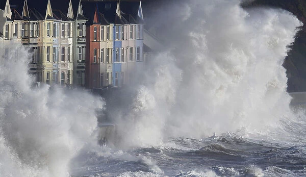 Waves hit the seawall during heavy seas and high winds in Dawlish in south west Britain