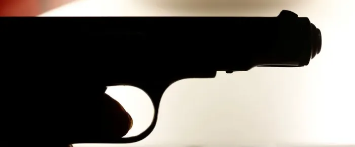 Framed Print : A weapon collector holds a 7. 65 caliber gun in his house in Bordeaux