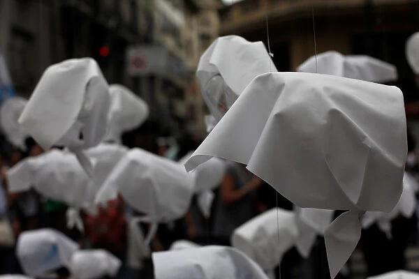 White scarves are seen hanging from a post during a demonstration to commemorate the 42th