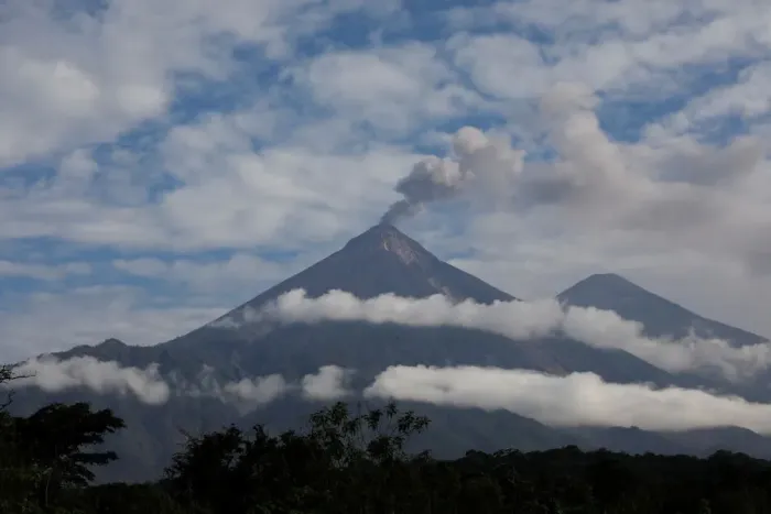 Framed Print : The Wider Image: Woman digs for family lost under Guatemalan volcano