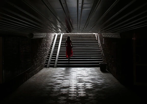 A woman climbs stairs in Donetsk
