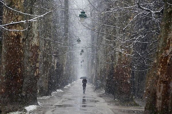 A woman walks during heavy snowfall in Sarajevo