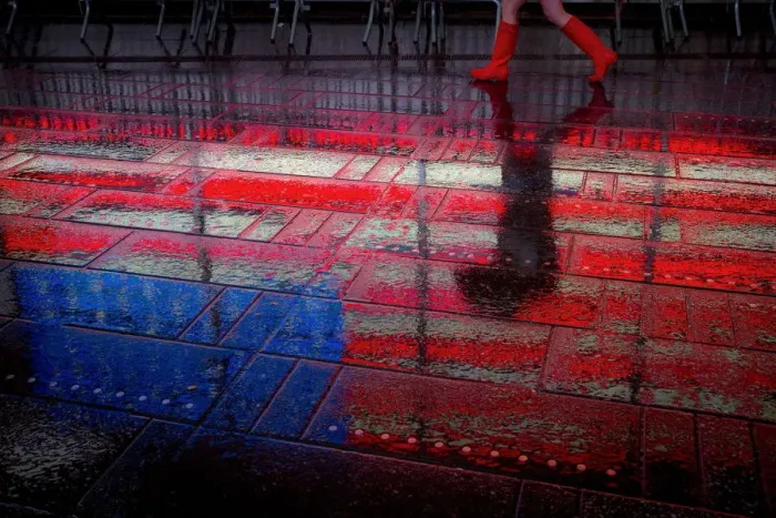 Framed Print : A woman walks through the rain in Times Square in Manhattan, New York Framed Print : A woman walks through the rain in Times Square in Manhattan, New York