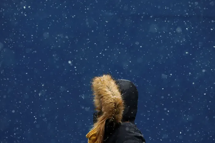 Framed Print : A woman walks in the snow at Times Square in New York Framed Print : A woman walks in the snow at Times Square in New York