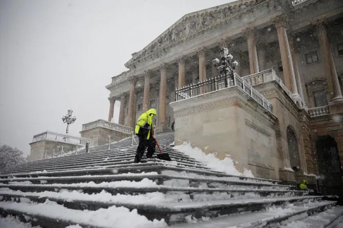Framed Print : Workers clear the steps of the House of Representatives on Capitol Hill in Washington