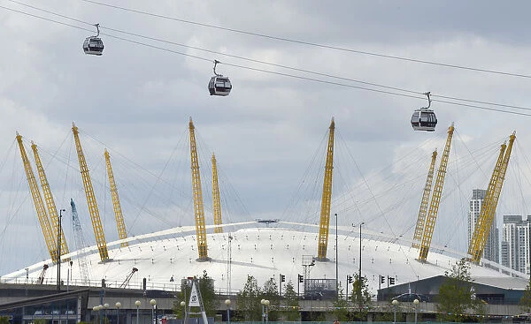 Workers sit in gondolas as they perform tests on the new cable car link across the