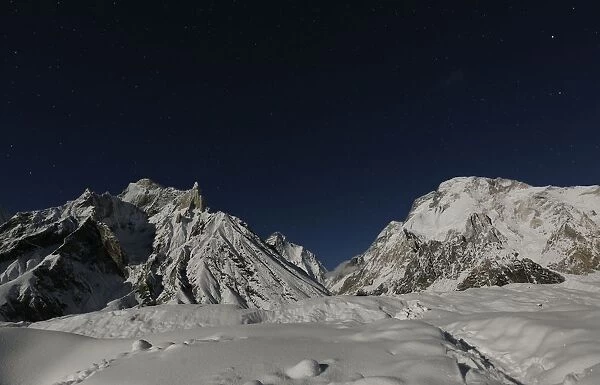 The worlds second largest mountain, the 8, 611 meter high K2 is illuminated by the moon