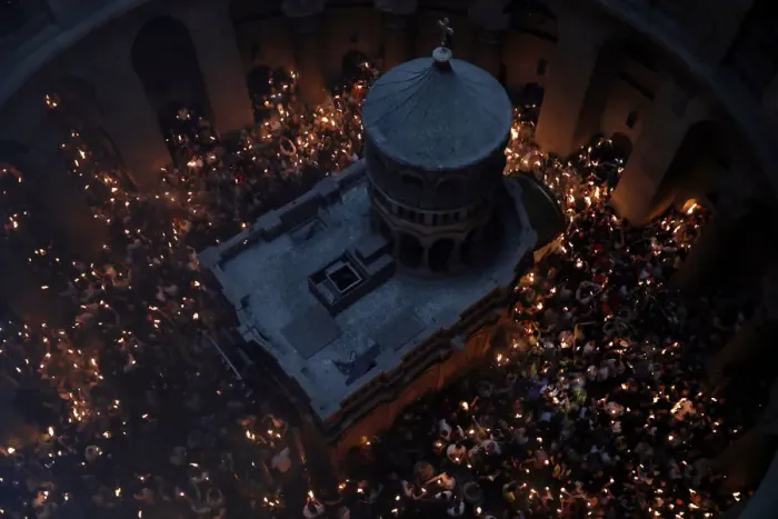 Framed Print : Worshippers hold candles as they take part in the Christian Orthodox Holy Fire ceremony