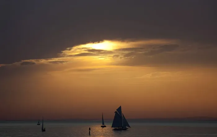 Framed Print : Yachts are silhouetted as sun sets over Lake Constance in Bregenz