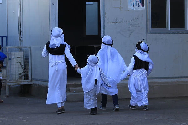 Yazidi students are seen at school in Sharya camp, in Duhok
