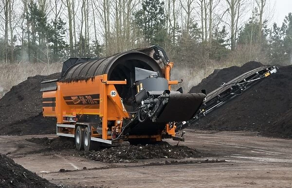 Doppstadt portable trommel screen, used to filter rubbish from green compost at municipal waste site, near Chester