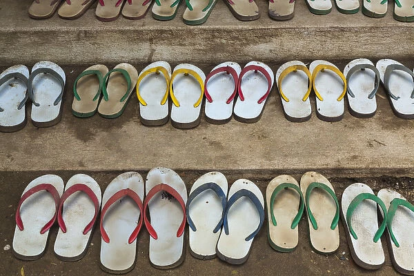 Myanmar, Yangon. Shoes lined up outside a monastery in Yangon