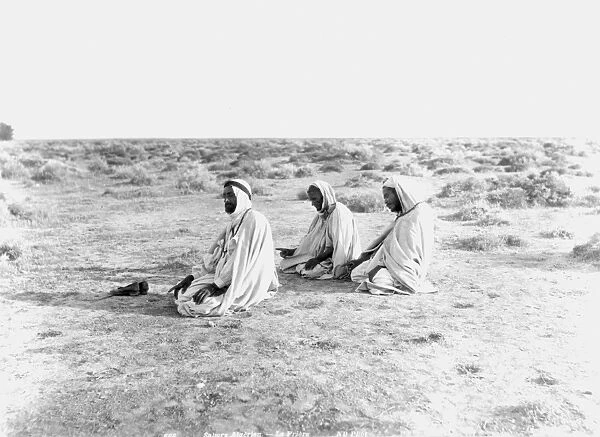 ARABS PRAYING, c1920. Arabs at prayer in the Tunisian desert: photograph, c1920