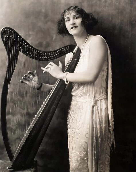 HARPIST, c1924. Publicity photograph for the Broadway show, The Best People