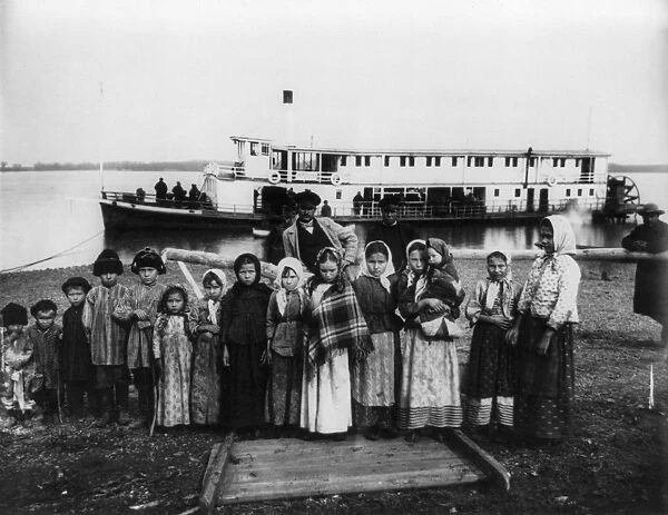 RUSSIA: RIVERBOAT, 1895. Russian peasants in front of a sternwheel steamboat on the Ussuri River