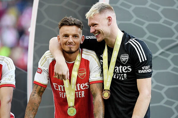 Arsenal's Ben White and Aaron Ramsdale Celebrate Penalty Shootout Victory in Community Shield Final (2023-24): Overcoming Manchester City at Wembley