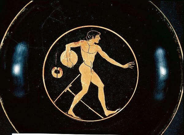 Red-figure pottery attic kylix depicting disc-thrower