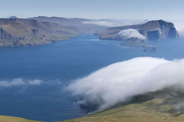 Bank of clouds over Vagar and Mykines, Utoyggjar, Faroe Islands, Denmark