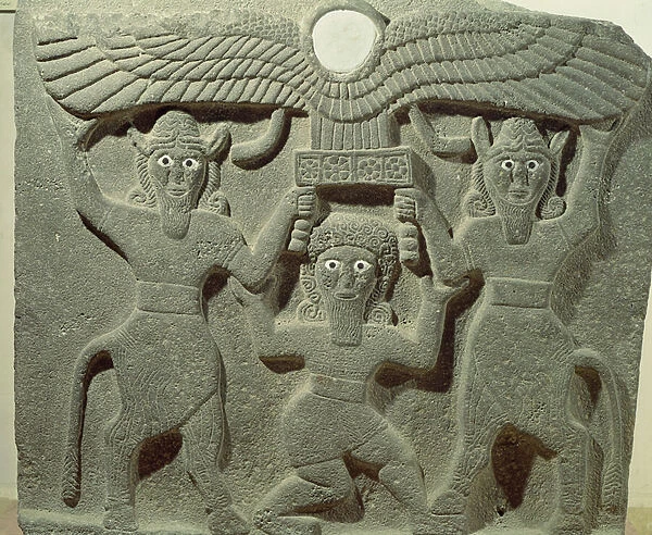 Relief depicting Gilgamesh between two bull-men supporting a winged sun disk