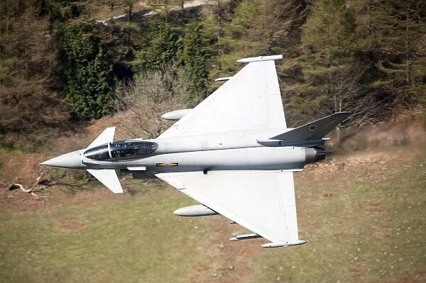 A Eurofighter Typhoon F2 aircraft of the Royal Air Force low flying over North Wales
