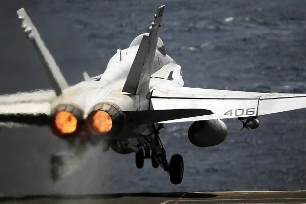 An F  /  A-18C Hornet launches from USS Abraham Lincoln