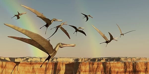 A flock of Pterodactyls fly out of a canyon
