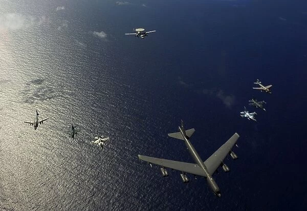 A U. S. Air Force B-52 Stratofortress aircraft leads a formation of aircraft