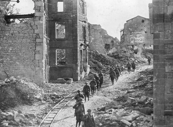 American soldiers passing through the ruins of Varennes, Meuse-Argonne Offensive, France, 1918