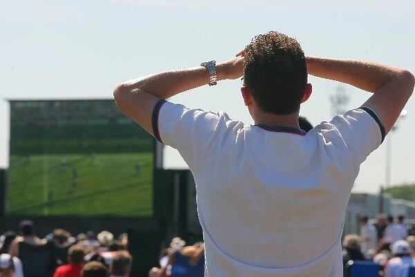 Formula One World Championship: A spectator watches the football