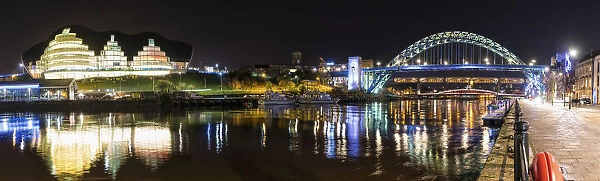 Tyne Bridge Illuminated At Nighttime Over River Tyne And Illuminated Buildings; Newcastle, Tyne And Wear, England