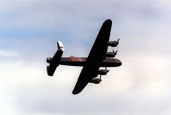 An Avro Lancaster bomber aircraft of the Battle of Britain Memorial Flight flies past