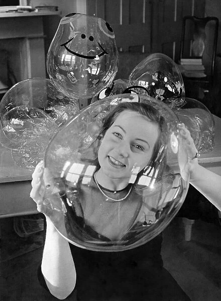 Barbara Hamilton, beauty queen of Egypt in 1945, seen through a bubble which she holds in