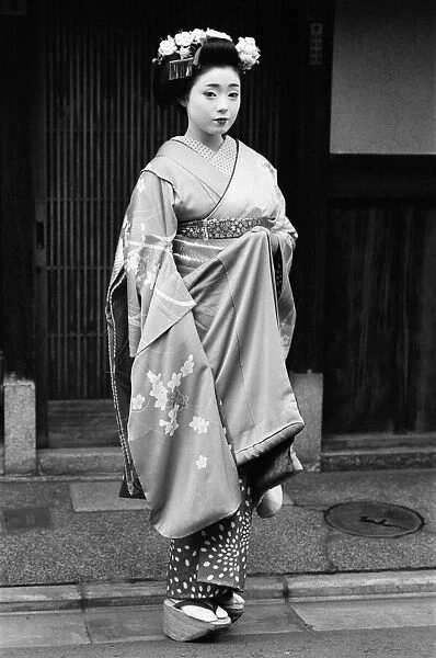 Geisha girl, Katsuno, pictured outside her Geisha House in Kyoto, Japan, 8th March 1982