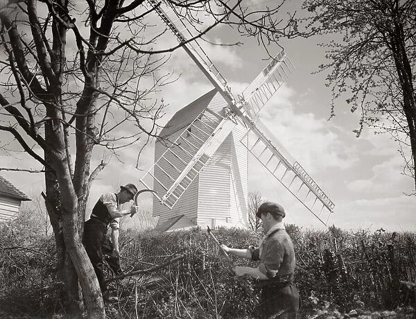 Men chopping wood near a windmill Windmills Windmill country Scene countryside