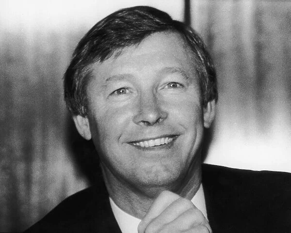 New Manchester United manager Alex Ferguson smiles after his appointment at Old Trafford