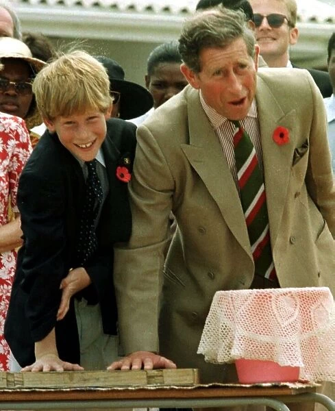 Prince Charles with his son Prince Harry leaving their hand prints in concrete on their