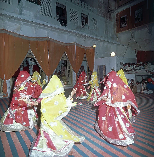 Group of women dancing during a festival in the city of Udiapur, state of Rajsthan, India