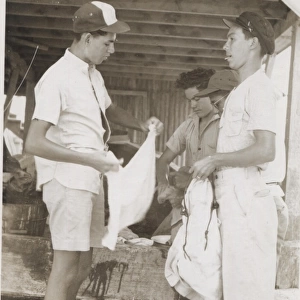 Boy scouts washing clothes at camp, British Honduras