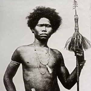 Probably the Philippines - man ritual scarring and spear