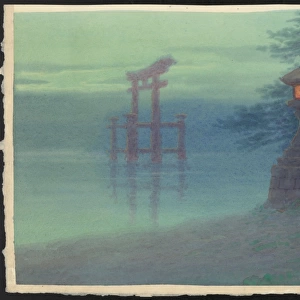 Stone lantern on shore and a torii in a lake