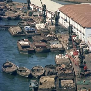 Boats and barges along the waterfront of the docks in Karachi