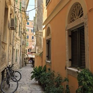 Narrow street with bike, Old Town, Corfu Town, Corfu, Ionian Islands, Greece