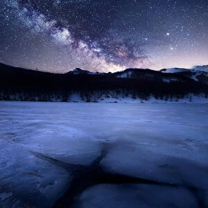Milky way over a frozen lake (Lago Baccio) in the central Appennines, Emilia Romagna