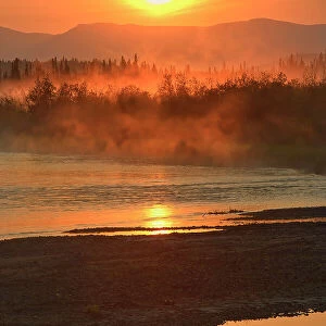 Rising fog on the Deasadeash River at sunrise and the Kluane Ranges, the easternmost of the St Elias Mountains. Kluane National Park, Yukon, Canada