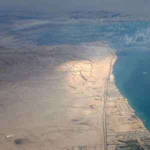An aerial view of the coast of the Red Sea is pictured through the window of an airplane