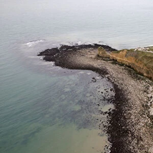 An aerial view shows the Pointe du Hoc cliffs and memorial in the Normandy region