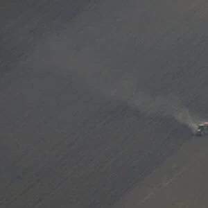 An aerial view shows a tractor plowing a field near Boryspil
