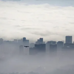 An airplane flies over buildings in Rio de Janeiro An airplane flies over buildings in Rio de Janeiro