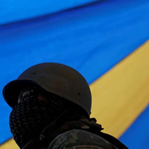 An armed forces member patrols during an operation against drug dealers in Vila Kennedy